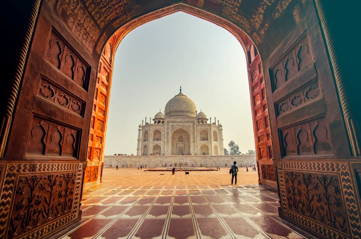 Taj Mahal framed by an ornate arched doorway